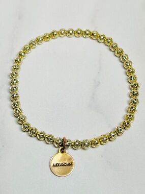 Alex and Ani Cut Out Beaded Gold Tone Stretch Bracelet with Brass Energy Charm
